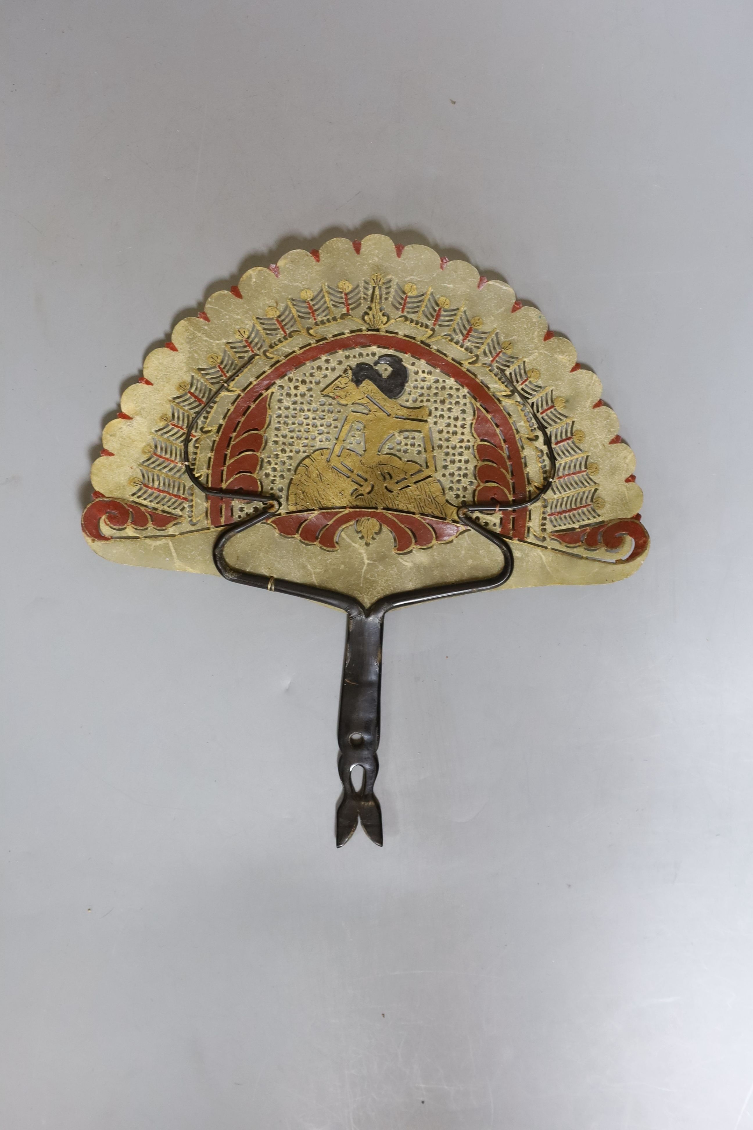 A Burmese carved hardwood figure, 51.5cm tall, and a Burmese horn and animal-bladder fan